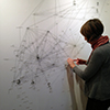 Artist Jehanne Paternostre sculpting the graphic representation of the Cavell Network